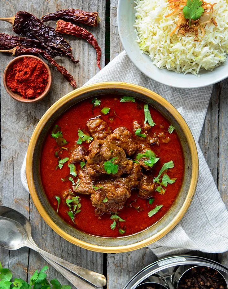 Mutton Rogan Josh, a rich and flavorful Indian curry dish made with lamb, yogurt, and aromatic spices https://hakeemrestaurant.in/
