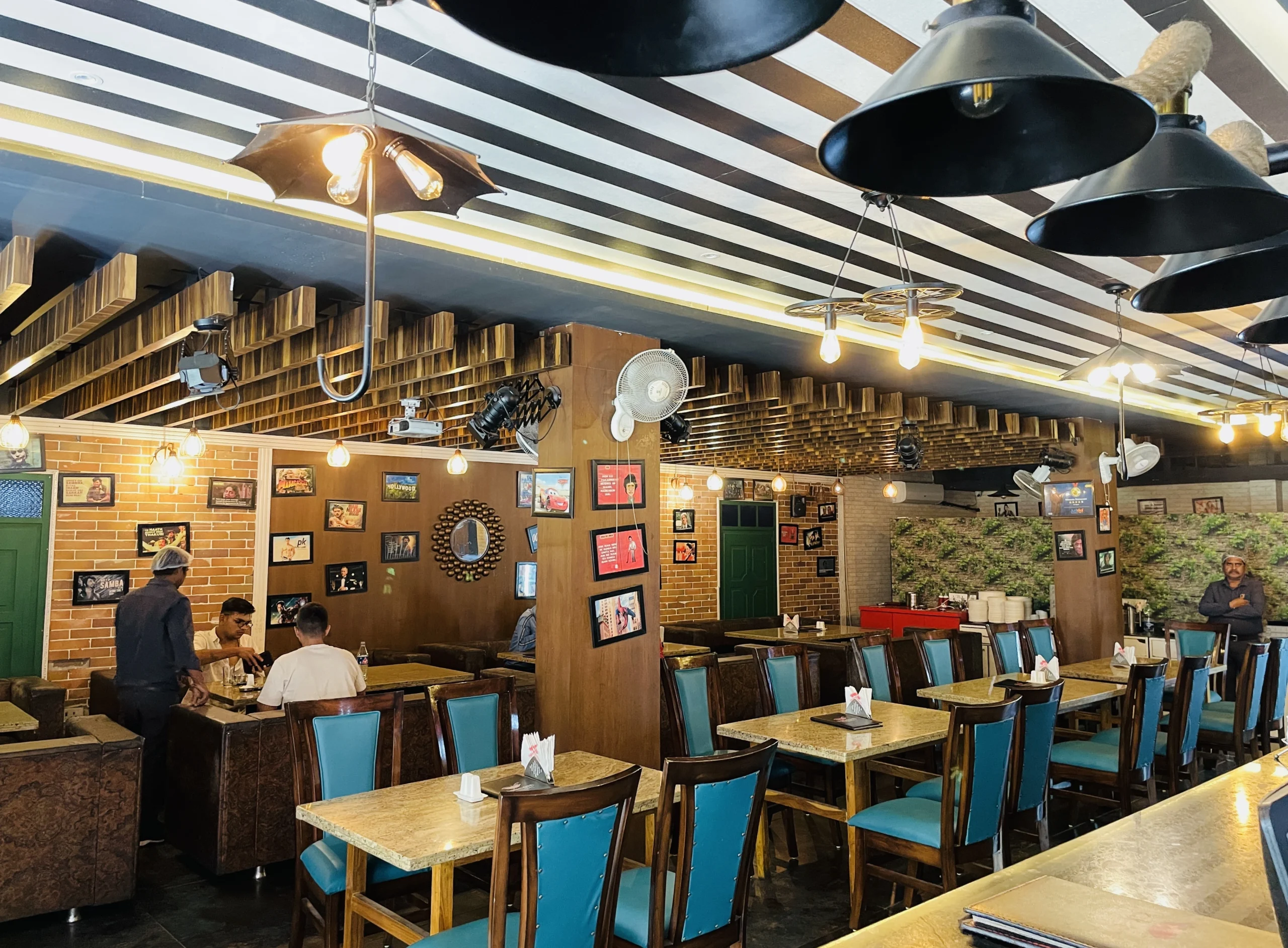 Interior of Hakeem Restaurant in Bhopal showcasing a spacious and stylish dining area with comfortable seating, warm lighting, and a lively ambiance, creating an inviting atmosphere for guest https://hakeemrestaurant.in/ Best Non-veg Restaurant